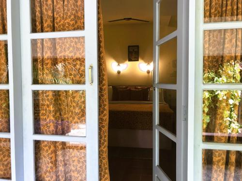 an open door with a view of a bedroom at Marari Dreamz Homestay in Mararikulam