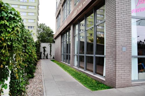 a building with windows on the side of it at Livin Apartments Santocka in Szczecin
