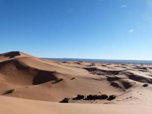a sand dune in the middle of a desert at Morocco Deluxe Camp - Assif n'Itrane in Lac Yasmins