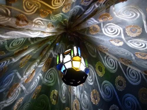 a lamp hanging from a ceiling in a room at Morocco Deluxe Camp - Assif n'Itrane in Lac Yasmins