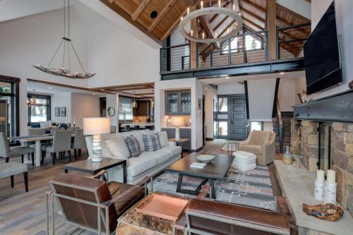a living room with a couch and a fireplace at 6 Jakes Lane by Moonlight Basin Lodging in Big Sky