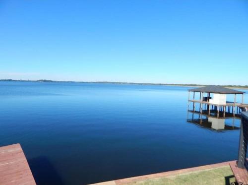 a view of a large body of water with a dock at Lake Front Lake House Paradise! in Pittsburg