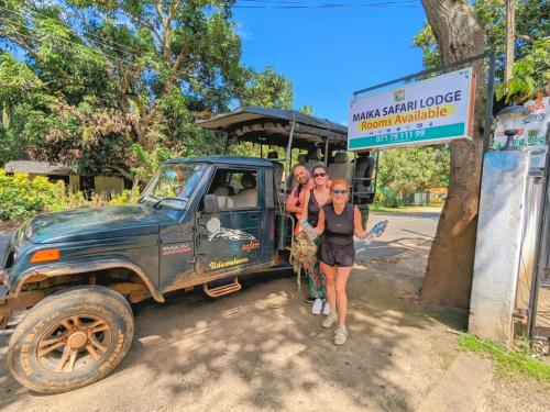 a group of people standing next to a truck at Maika safari lodge in Udawalawe