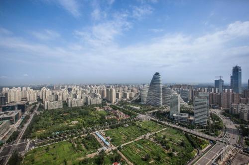 an aerial view of a city with tall buildings at Holiday Inn Beijing Focus Square by IHG in Beijing