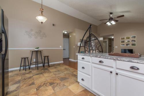 a kitchen with white cabinets and a counter top at Hamburg Haven Garage Fire Pit 7mi to Rupp WiFi in Lexington