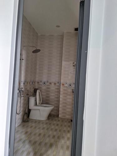 a bathroom with a toilet and a shower at C2.53 Hoàng My Villa in Vung Tau