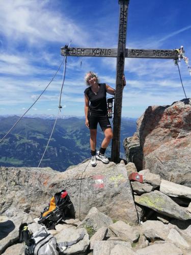 a man standing on the top of a mountain at Ferienwohnung Bonny in Schlitters