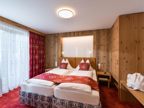 Postel nebo postele na pokoji v ubytování Hotel Feichter