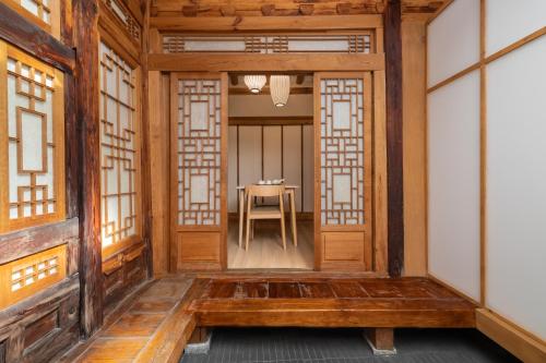 an entrance to a room with a table in the distance at Luxury hanok with private bathtub - SN08 in Seoul