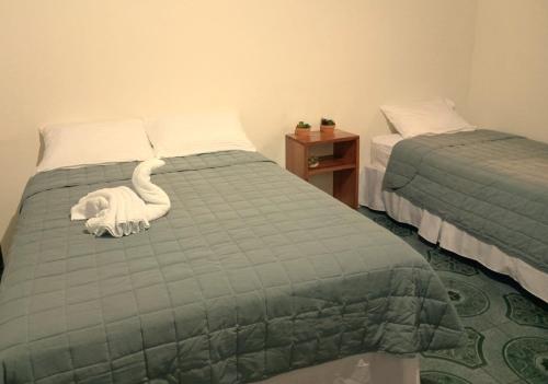 Katil atau katil-katil dalam bilik di Chill House Flores