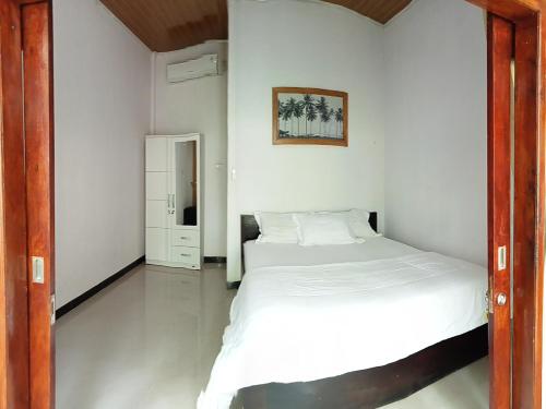 Ένα ή περισσότερα κρεβάτια σε δωμάτιο στο Walur Surf Villa
