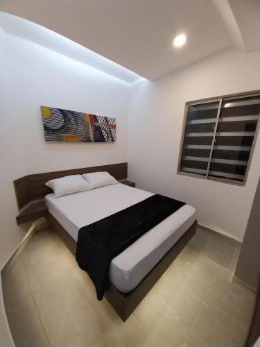 מיטה או מיטות בחדר ב-Grace Hotel Guaranda