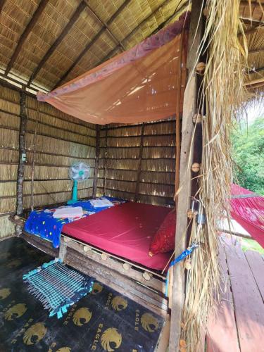 Sweet Jungle Campingにあるベッド