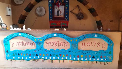 a bulletin board with the words kirkpatrick noram house at Kabara Nubian House in Abu Simbel