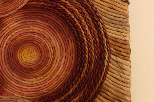 a close up of a piece of wood with a spiral at Hotel Pules in Yogyakarta