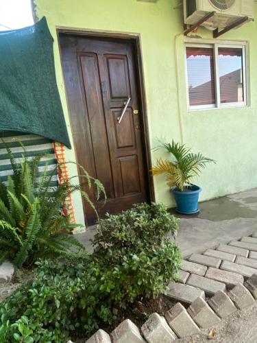 a door of a house with plants in front of it at Aeropark Residencial (B&B) in Maputo