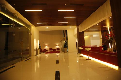 a lobby of a building with a hallway with a lobby at Keys Select by Lemon Tree Hotels, Whitefield, Bengaluru in Bengaluru