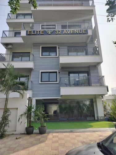 a building with blue avenue written on it at The Hoften Elite 32 Avenue, Sector 15, Gurugram in Gurgaon