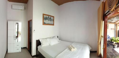 Ένα ή περισσότερα κρεβάτια σε δωμάτιο στο Walur Surf Villa