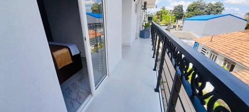 a balcony with a view of a building at Ivory Laze Hotel in Negombo