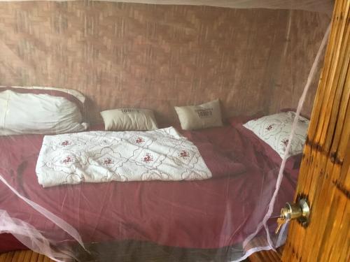 Postel nebo postele na pokoji v ubytování Kubo B M&K's Guesthouse