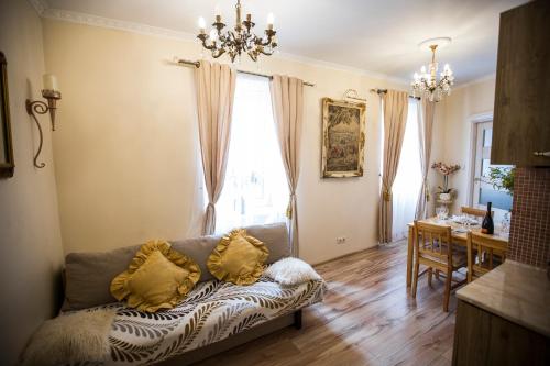 a living room with a couch and a table at Obok Poczty blisko Rynku in Wałbrzych