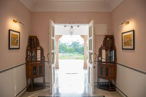 an open door in a room with a hallway at Naila Kothi - A Luxury Boutique Royal Suites in Jaipur in Jaipur