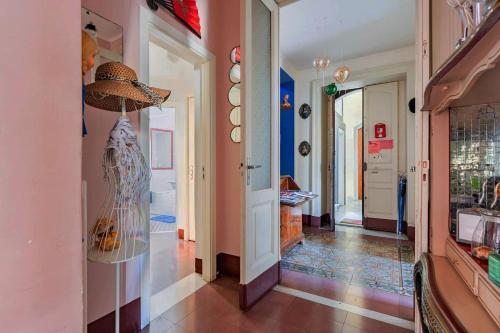 a hallway of a home with a glass display case at La Cot B&B in Catania