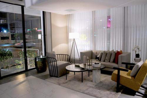 a living room with a couch and a table at Al Muhaidb Residence Jawazat in Riyadh