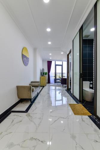 a large bathroom with a tub and a toilet at Aura Apartment Da Lat in Da Lat