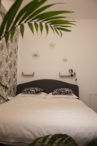 a bedroom with a bed with two pillows on it at Scandinavian for you in Bacău