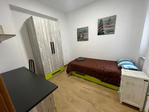 A bed or beds in a room at Alba Renueva 6
