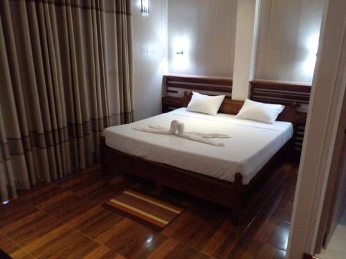 Katil atau katil-katil dalam bilik di Gangana Resort Inn