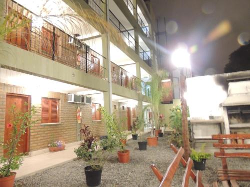 a building with potted plants on the side of it at Hotel Buenos Aires in Salta