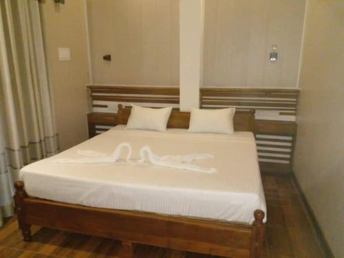 Katil atau katil-katil dalam bilik di Gangana Resort Inn