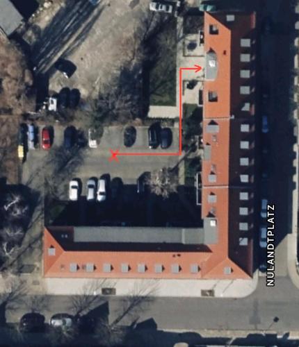 an aerial view of a parking lot with a building at Aura - Oase#1 - 2 Zimmer, 4 Betten, Küche, Balkon, Waschmaschine in Merseburg