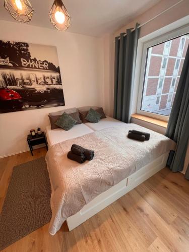 a bedroom with a bed with two bags on it at Monteurswohnungen in Dorsten - Zentrum - NEU saniert in Dorsten