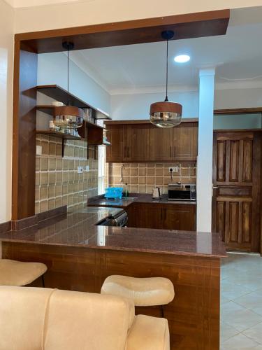 Een keuken of kitchenette bij Adea Apartments Muyenga