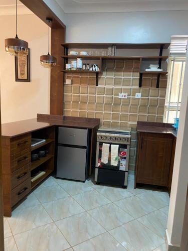 Een keuken of kitchenette bij Adea Apartments Muyenga