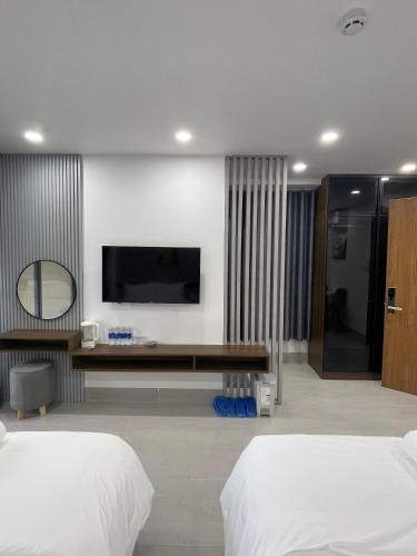TV a/nebo společenská místnost v ubytování Lagi Beach Hotel