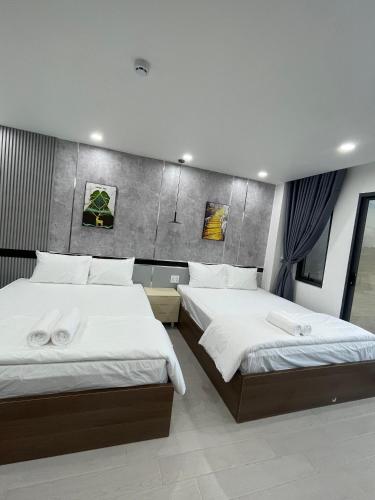 Postel nebo postele na pokoji v ubytování Lagi Beach Hotel