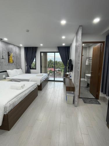 Postel nebo postele na pokoji v ubytování Lagi Beach Hotel