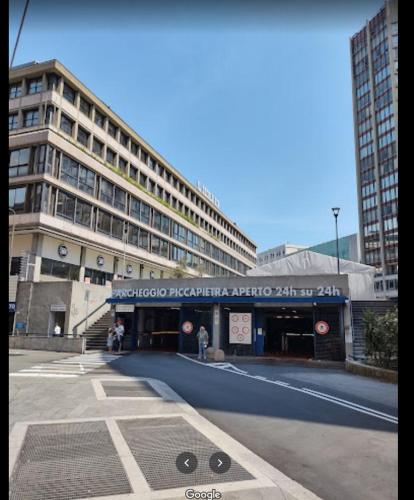 a large building on a street in a city at Hotel Palazzo Grillo in Genova