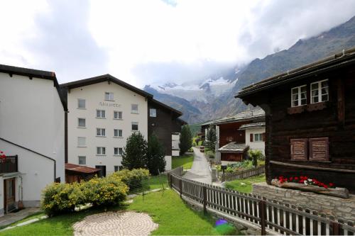 a view of a town with mountains in the background at Chalet Heimeli in Saas-Fee