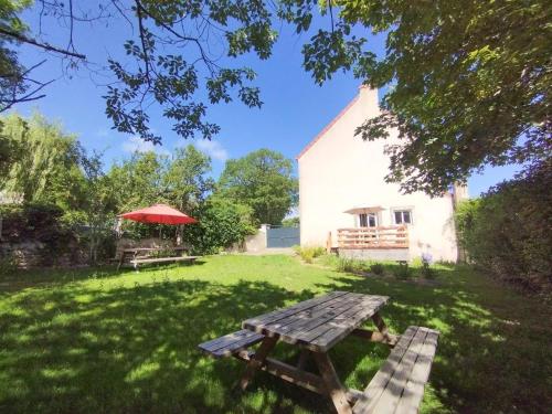 a picnic table in the yard of a house at LA VIGNE in Saulieu