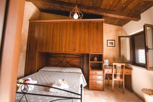 A bed or beds in a room at Calàmi - Villa Romeo - Private Apartments with Pool, Seaview & Olive Grove