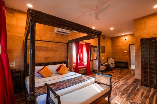 a bedroom with a large bed in a room at Hotel Helsinki House in Jaisalmer