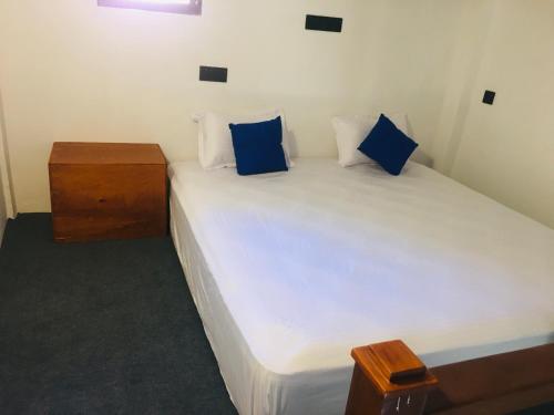 Ένα ή περισσότερα κρεβάτια σε δωμάτιο στο LUMI CASA MIRISSA