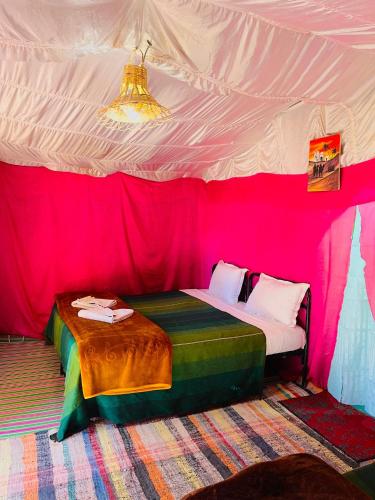 a room with a bed in a tent at Bivouac Lot Of Stars in Ouarzazate