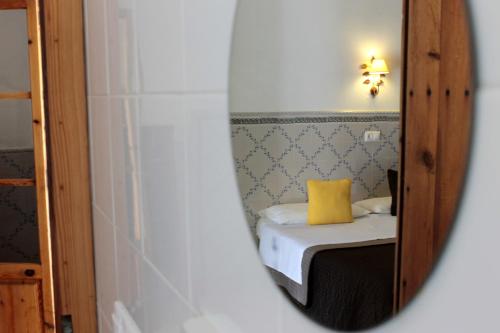 Ένα ή περισσότερα κρεβάτια σε δωμάτιο στο Hostal Catalina Vera